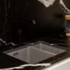 Black Mirage Porcelain sink area with white veining and integrated cut-out