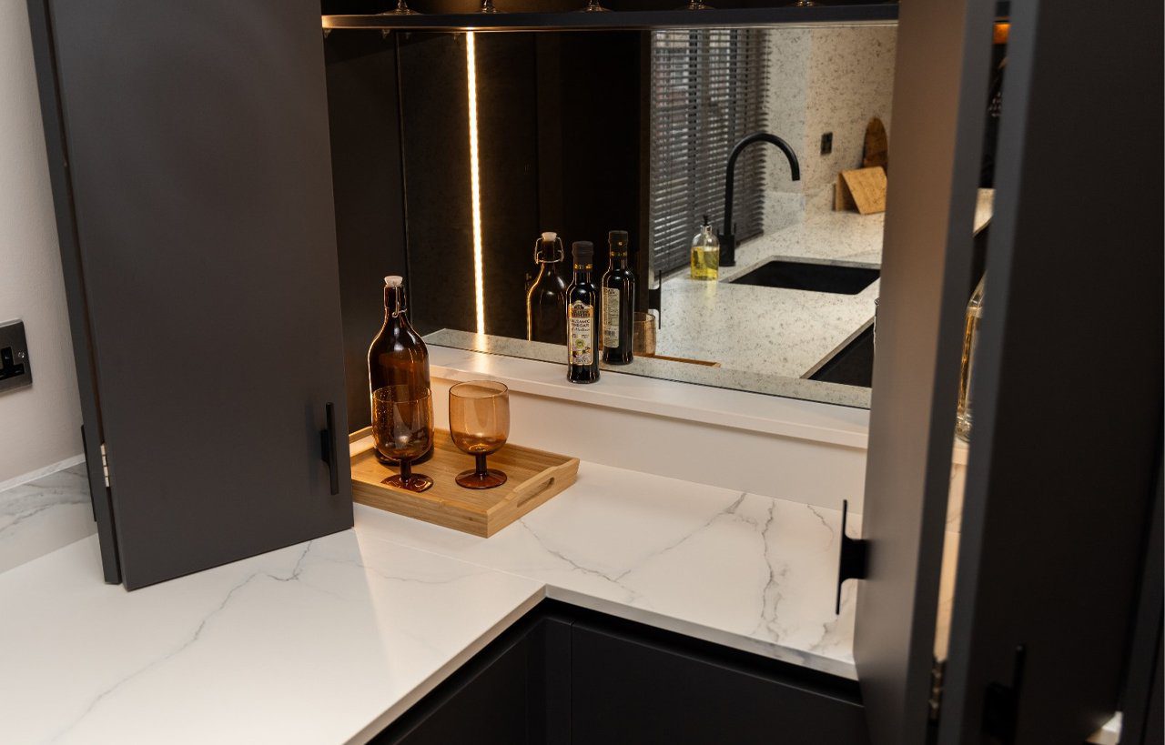 Volakas White Porcelain worktop by the sink area with a polished finish, shown with tap and countertop items.