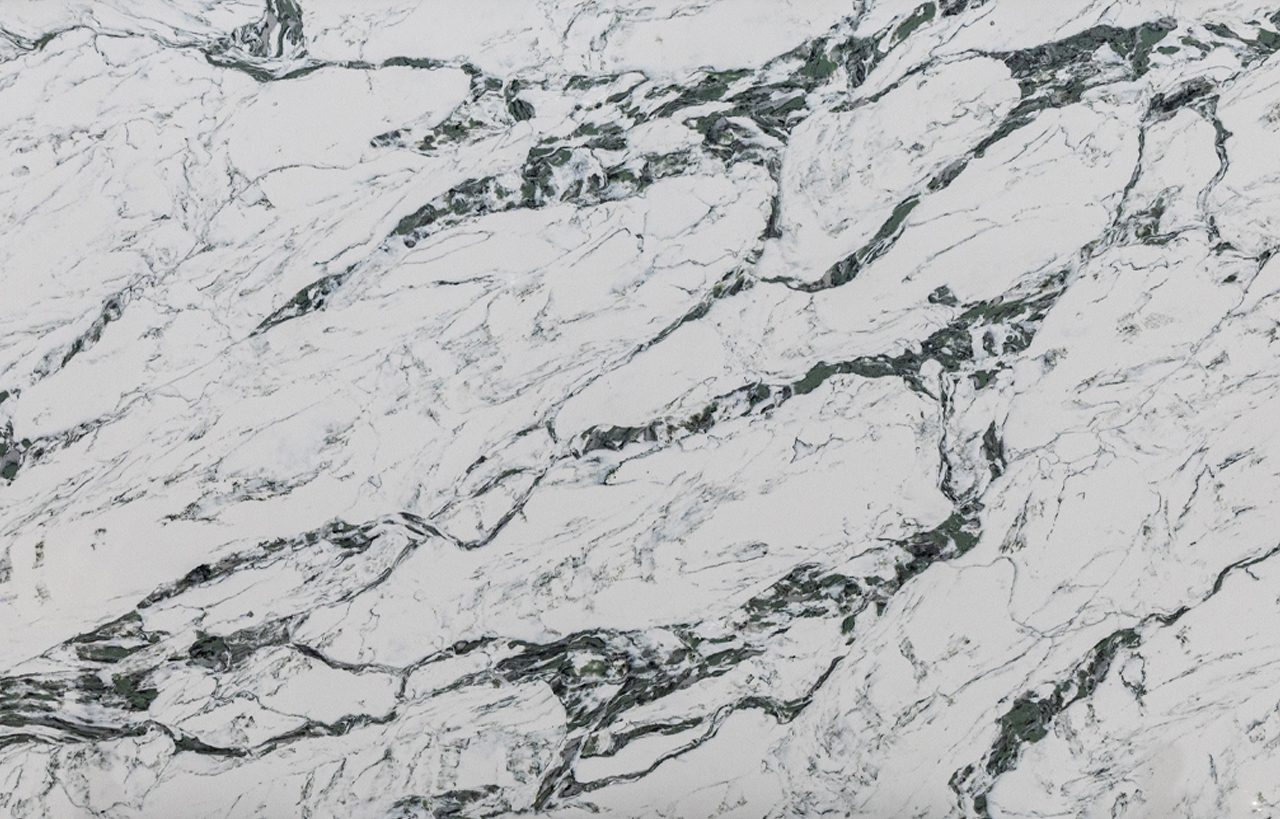 Emerald Calacatta Quartz slab close-up with bold dark green veining and white marble-effect background