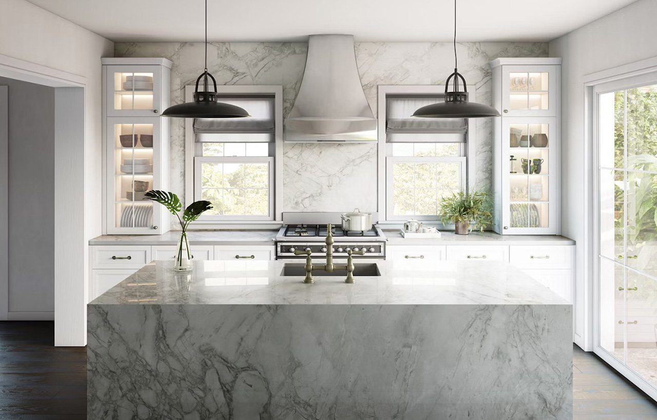 Bergen Porcelain island worktop with a light stone effect and soft grey veining, shown as a waterfall edge centrepiece in a bright kitchen