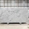 Calacatta Super White Porcelain full slab on a display stand, showing a bright white base with layered grey veining and soft shading