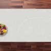 Desert Silver Quartz worktop shown from above with pale grey surface and soft white veining across a light finish
