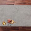 Kreta Porcelain worktop slab with concrete effect finish shown in an overhead kitchen styling