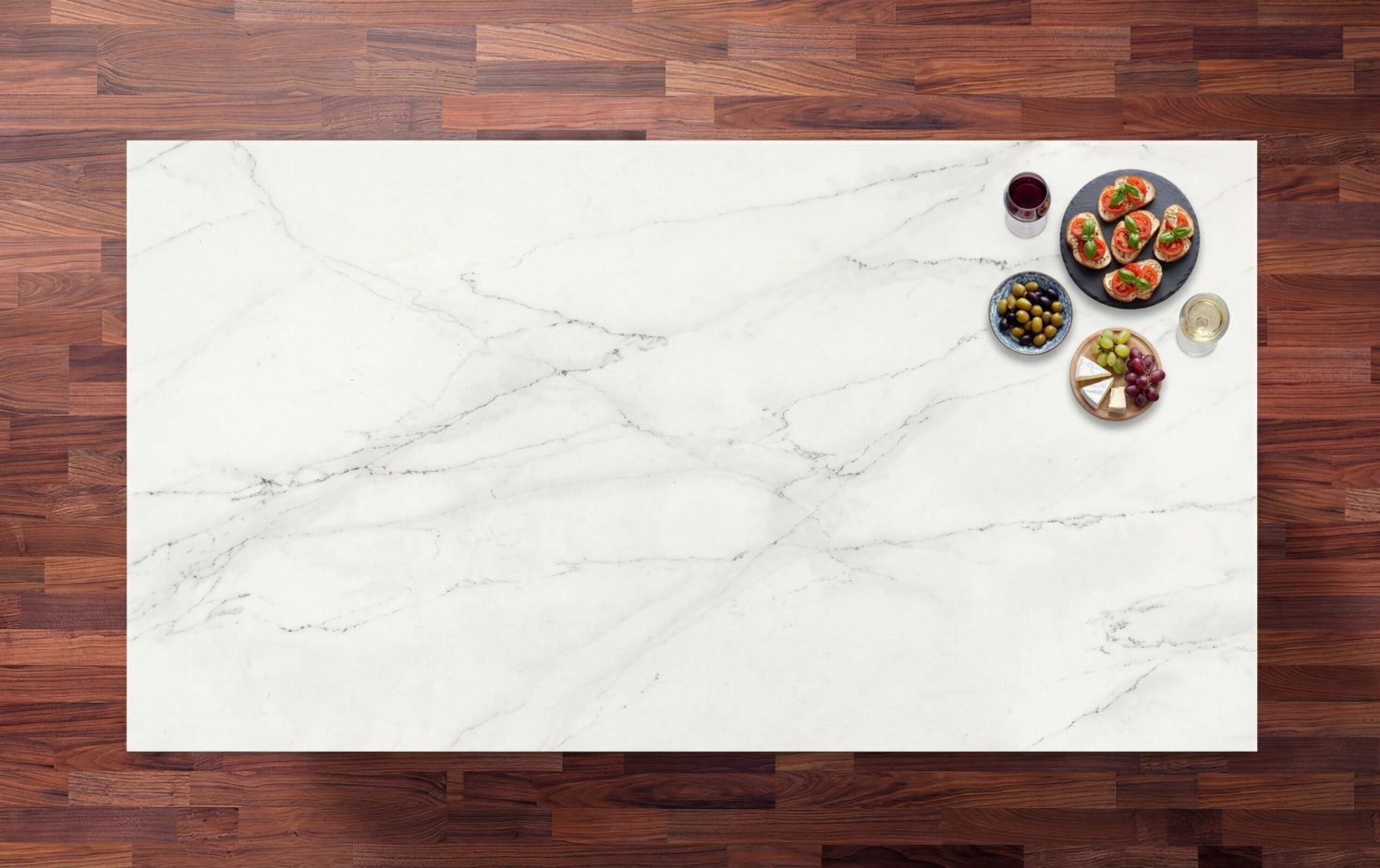 Rem Porcelain worktop in bright white with soft grey veining, styled with spices and small bowls on a timber surround