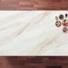 Fusion Gold Porcelain worktop shown from above with soft gold veining on a light base and small bowls placed in the corner