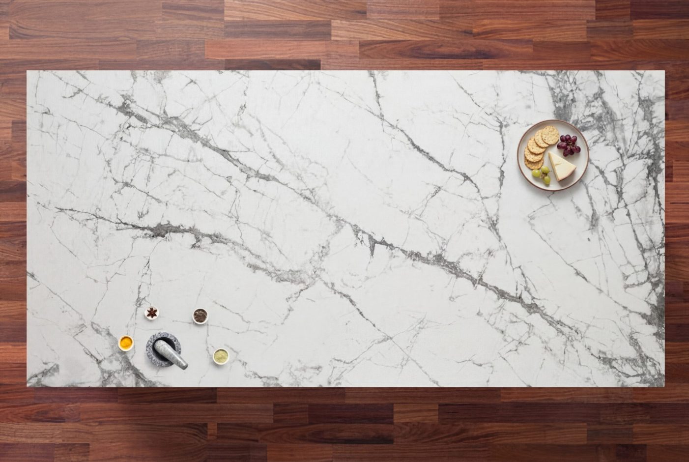 Invisible White Porcelain worktop slab with soft grey veining shown in a styled overhead kitchen scene