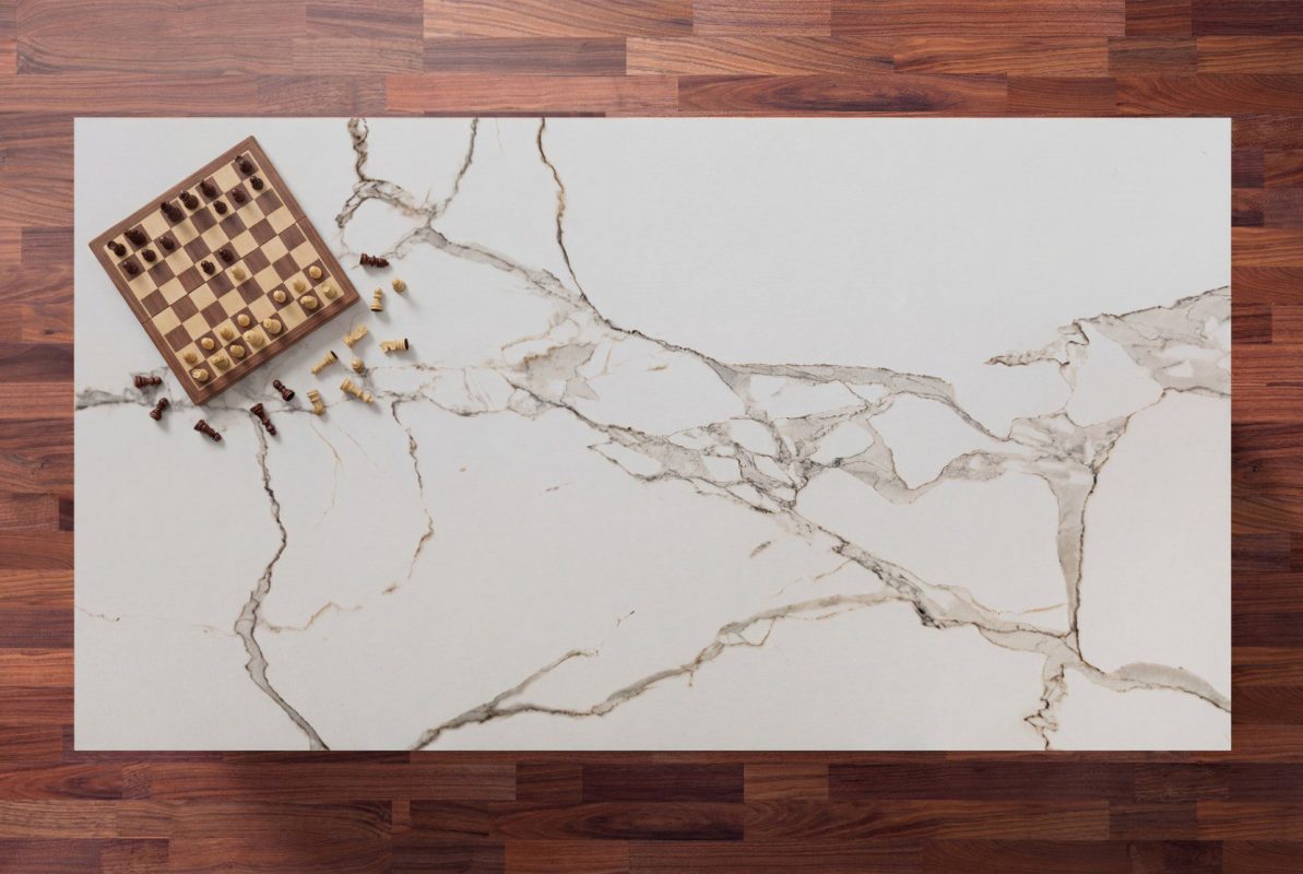 Calacatta Oro Porcelain island surface with white background and gold veining