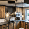 Corner kitchen view with Steel Grey leather Granite worktops and matching splashback detail, shown with rustic wood cabinetry and pendant lights above the worktop.