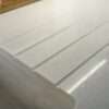 Close up of Aspen Shimmer Quartz drainer grooves with polished finish