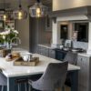 Super White Quartz island worktop in an open-plan kitchen with breakfast bar seating and a light marble-effect pattern