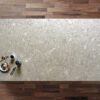 Venetian Drift Quartz worktop shown from above with warm grey stone-effect pattern and subtle flecks across the surface