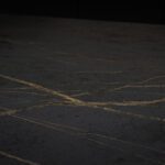 Close-up of Laurent Porcelain worktop surface showing a dark porcelain finish with fine gold veining.