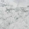 Calacatta Super White Porcelain close-up showing a bright white base with clustered grey veining and soft clouded shading