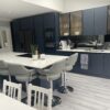 Aura 15 Porcelain slab with subtle grey veining on white background