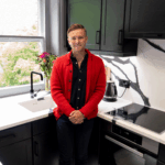 Will testimonial kitchen featuring Black Calacatta Quartz worktops with bold veining and a matching splashback