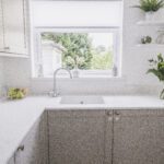Bluetta Carrara Quartz sink run by a window showing a smooth white surface and clean finish
