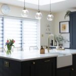 Blanco Zeus Quartz island worktop in a modern kitchen with a bright white surface and pendant lighting above