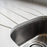 Blanco Zeus Quartz drainer grooves and sink close-up showing clean channels formed into the white worktop surface
