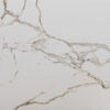 Calacatta Oro Porcelain surface with white background and gold veining