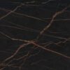 Laurent Porcelain surface detail showing dark porcelain with warm gold veining running diagonally across the worktop.