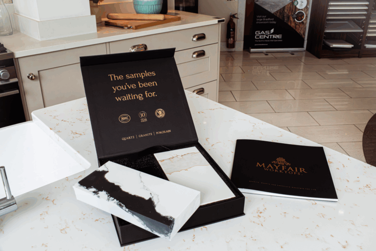 Mayfair Worktops sample box set for Quartz, Porcelain and Granite worktops shown on a worktop surface