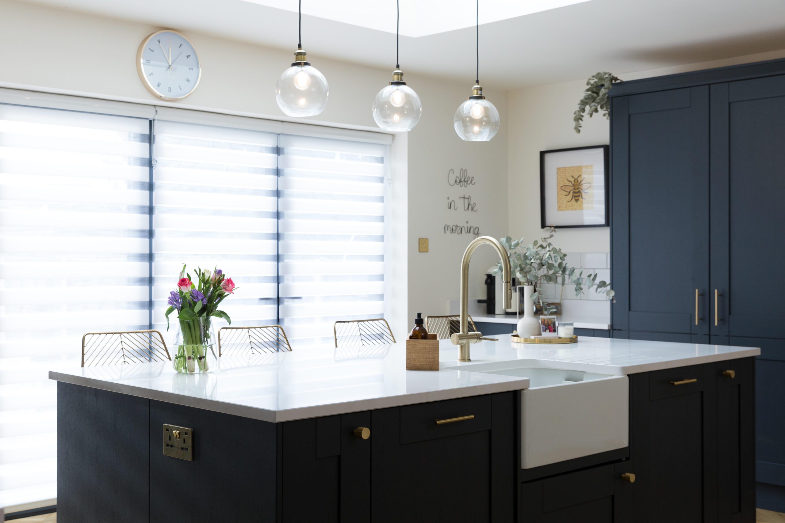 Blanco Zeus Quartz island worktop in a modern kitchen with a bright white surface and pendant lighting above