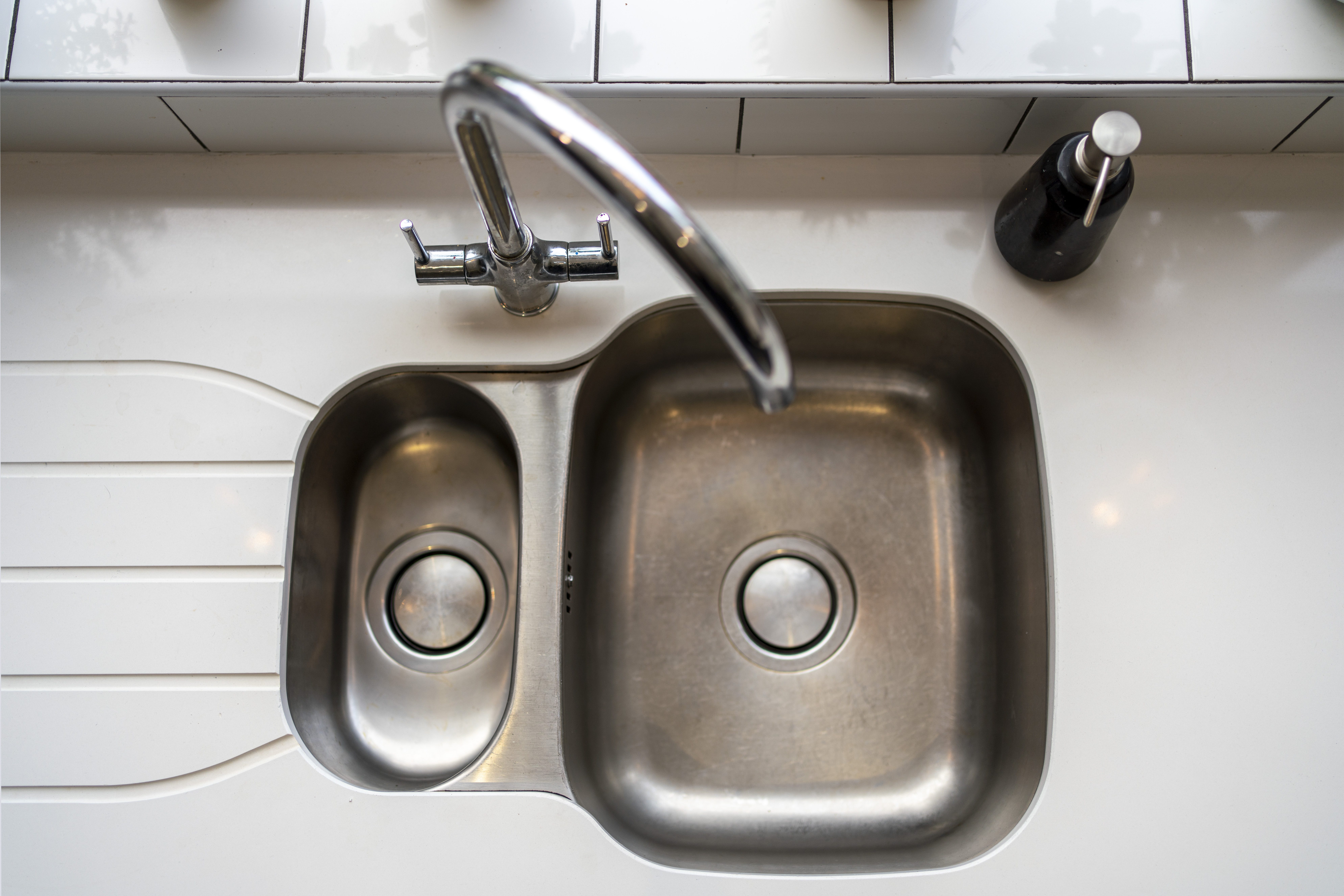 Blanco Zeus Quartz worktop with inset double bowl sink and chrome tap shown from above on a bright white surface
