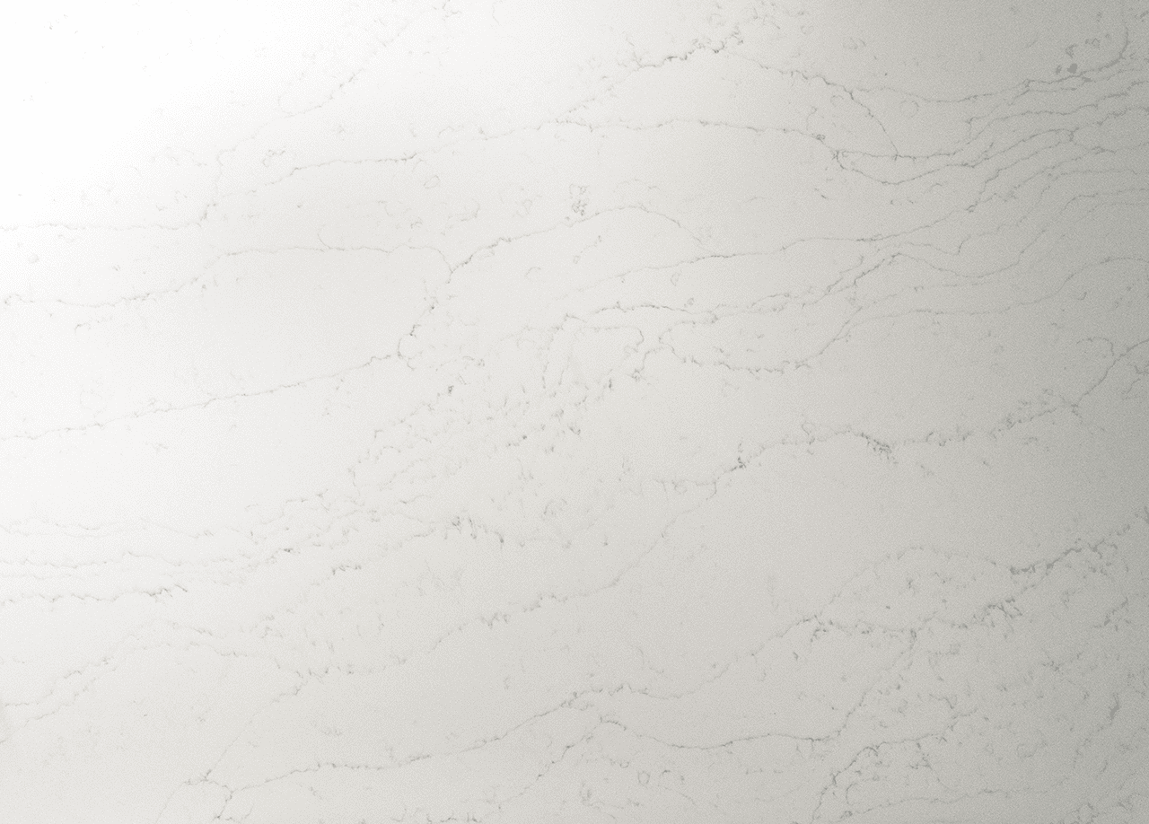 Close up of Statuario Bianco Porcelain surface showing delicate grey veining on a white base