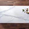 Volakas White Porcelain slab close up showing soft grey veining across a bright white background