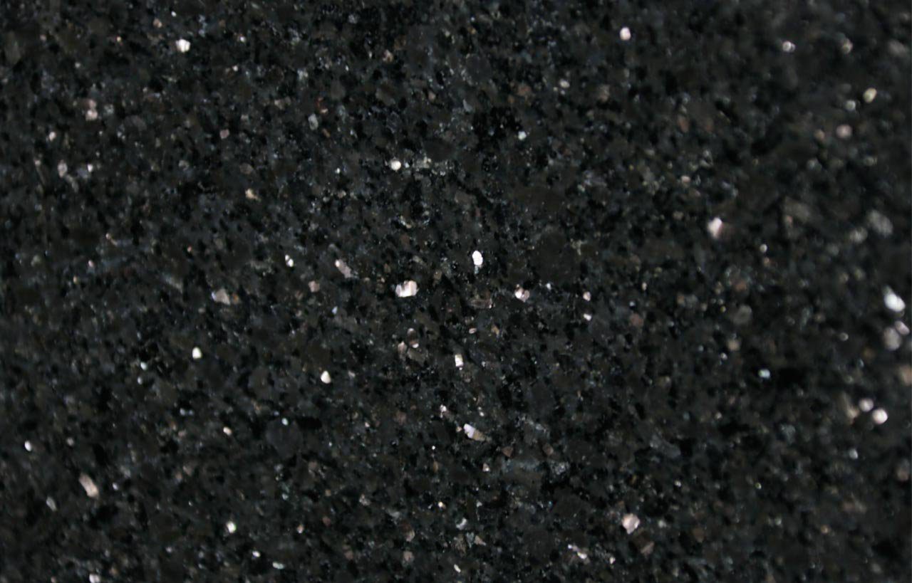 Close up slab photo of Star Galaxy Granite showing a deep black base with dense sparkling flecks and natural crystal patterning.